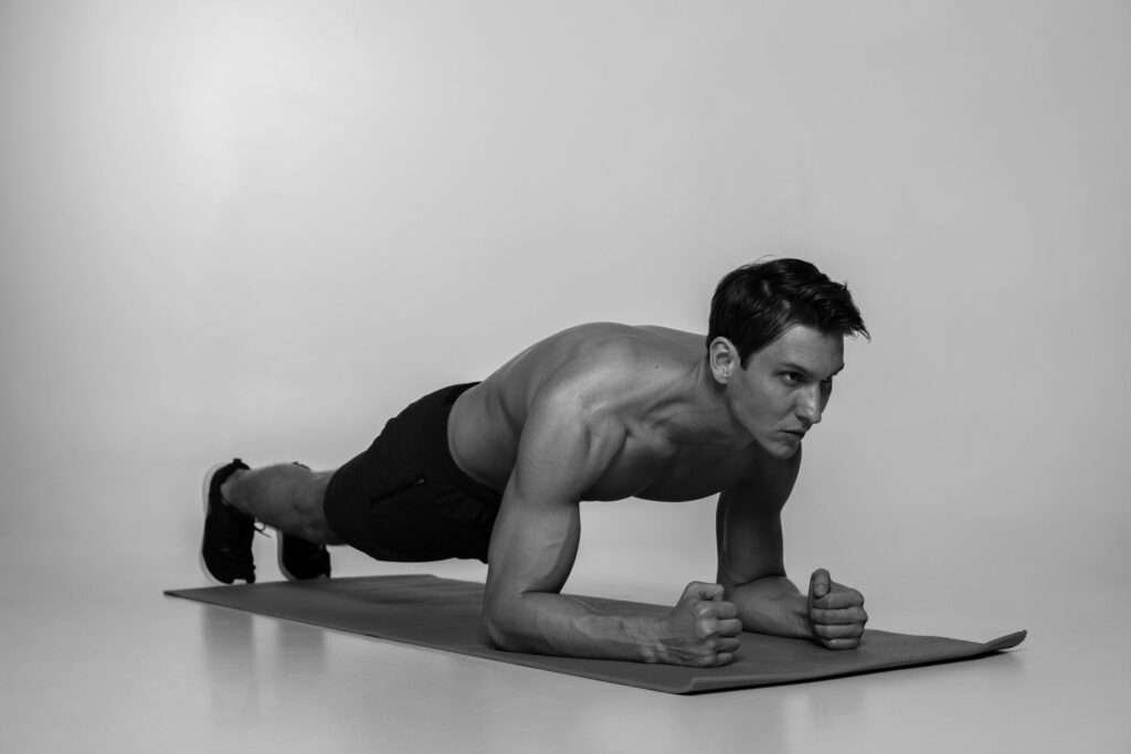 A person engaged in a plank workout routine, focusing on building upper body strength during a 30-minute workout session.