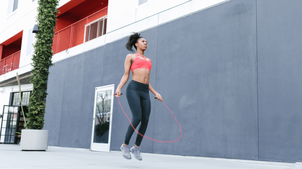 Image of a women jumping rope indoors, representing the fun and effectiveness of jump rope workouts for home cardio.