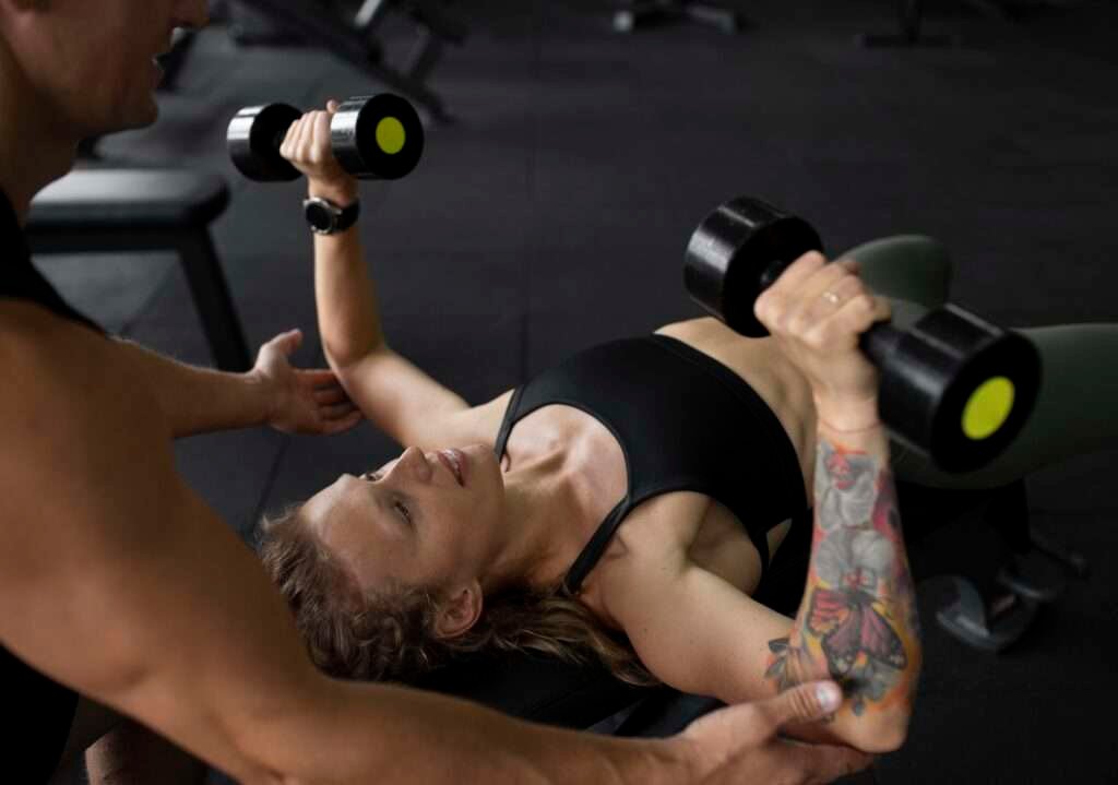 A dedicated individual engaging in a chest workouts with dumbbells, skillfully performing a dumbbell bench press to sculpt and strengthen the pectoral muscles.